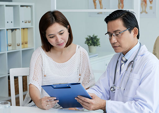 female asian patient providing informed consent in healthcare