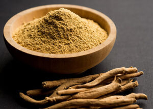 gezondheidsvoordelen van ashwagandha in een kom op een zwarte tafel