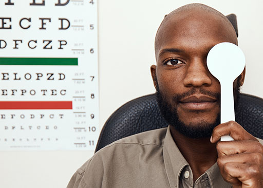 african male tested for macular degeneration during eye exam