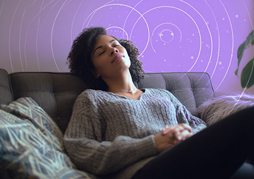 person resting on a couch practicing self compassion therapy