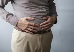 person holding their stomach