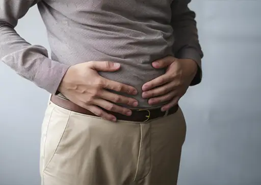 person holding their stomach