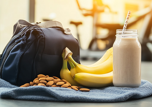 gym bag with a banana protein shake and nuts
