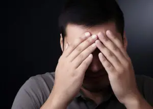 person experiencing persistent nausea