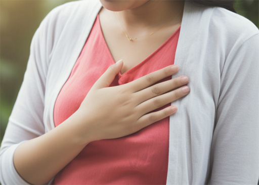 person fatigued and holding their chest