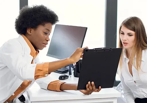 african american doctor interacting patient engagement in healthcare with lady