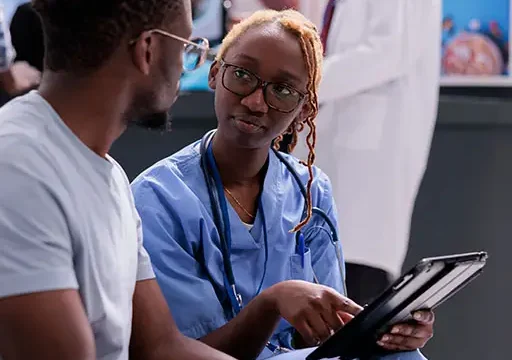african-american-patient-and-nurse-discussing-results-of-bioresonance-testing