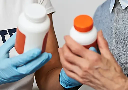 caretaker and elderly lady using medication reconciliation between two options