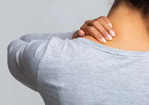 lady experiencing body tension in her neck