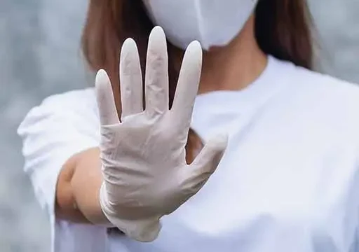 nurse holding her hand up preferring non pharmacological pain management