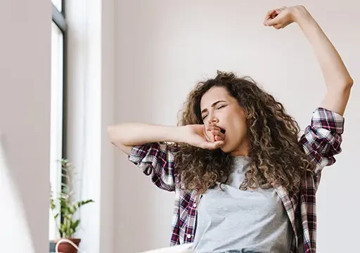 white lady taking midday stretch for occupational dimensions of wellness